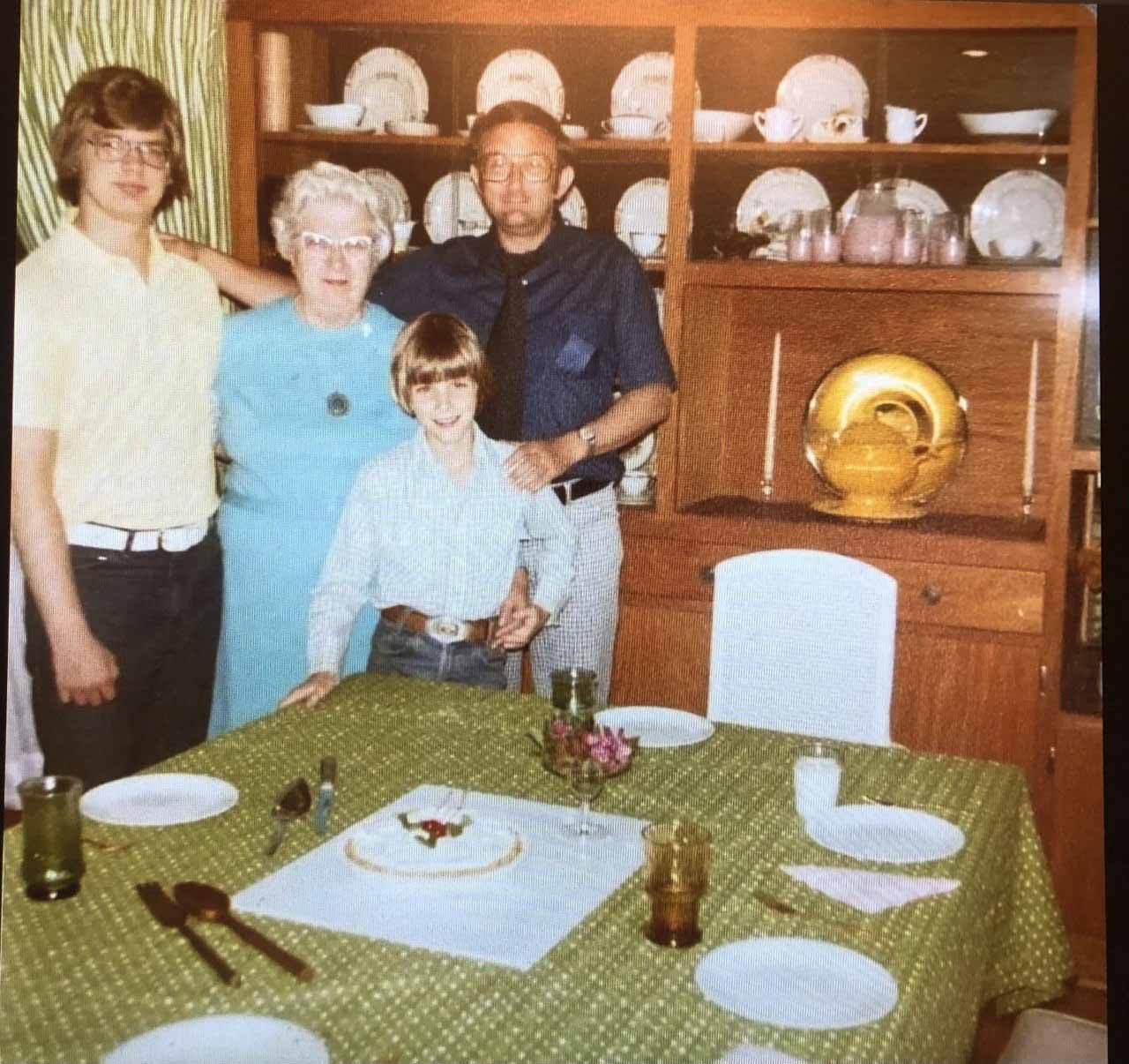 Family photograph showing a teenage Jeff Dahmer standing with his grandmother, brother, and father.