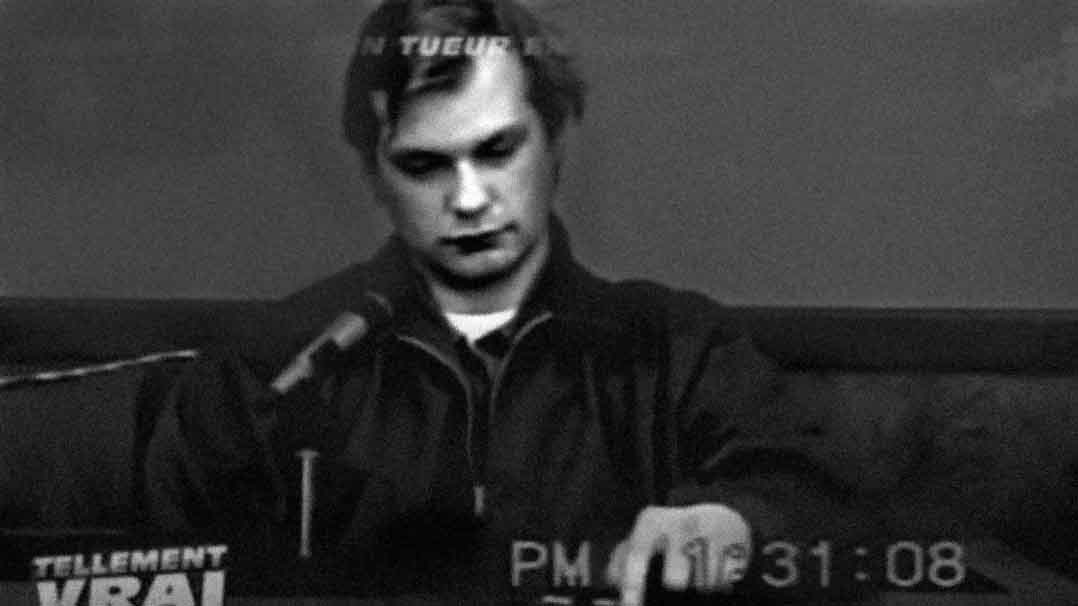 Black-and-white image of Jeff Dahmer sitting in a courtroom during the Sinthasomphone deposition.