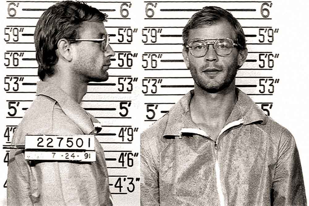 Black-and-white booking photograph of Jeffrey Dahmer used in official records, illustrating how institutional imagery helped fix the “serial killer” narrative.
